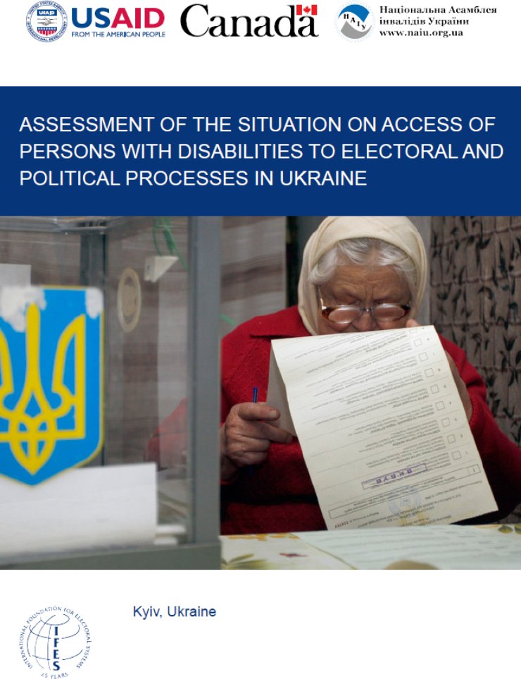 An older woman looks down at a ballot in a Ukrainian polling room